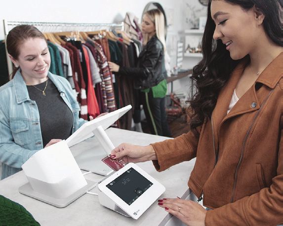 Customer showing their Freebees card during a payment on a Clover terminal